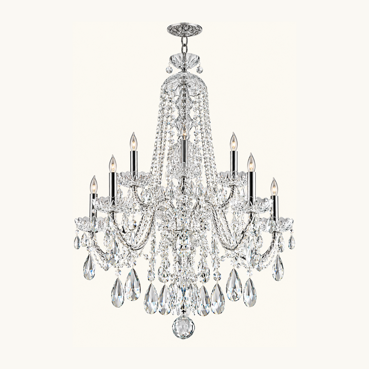 A multi-light crystal chandelier with a polished silver-tone metal frame, featuring clear hanging teardrop crystals and candle-style bulbs, shown against a solid off-white background.