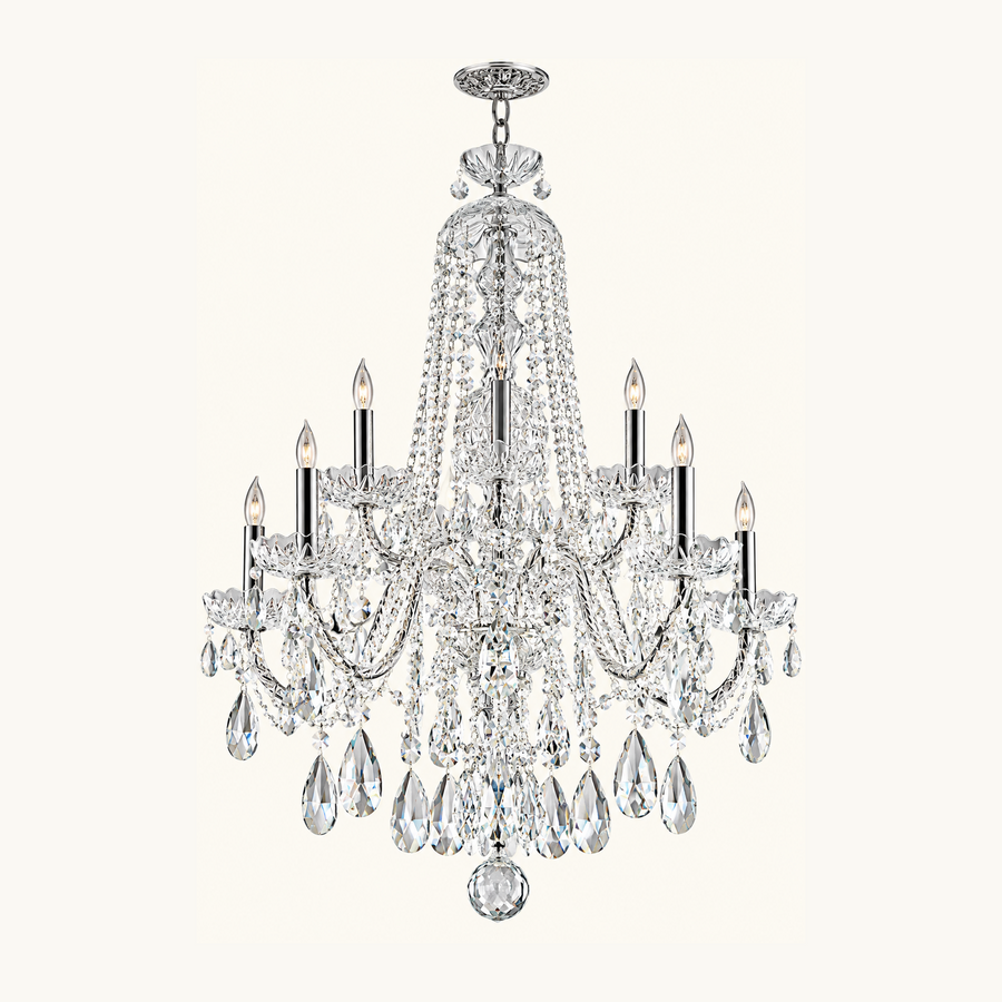 A multi-light crystal chandelier with a polished silver-tone metal frame, featuring clear hanging teardrop crystals and candle-style bulbs, shown against a solid off-white background.