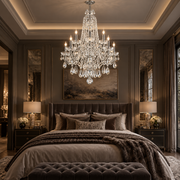 A luxurious bedroom featuring a large multi-tiered crystal chandelier hanging above a bed with neutral-toned bedding, flanked by matching nightstands and lamps in a dark, elegant room.