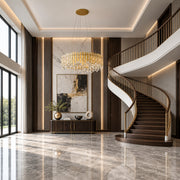 Chatter 12-light pendant in gold mirror displayed in a walnut contemporary grand foyer