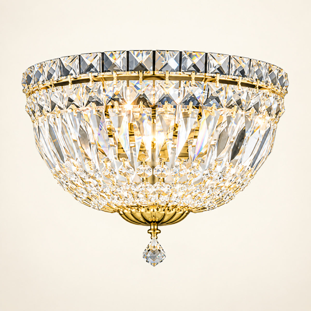 Petit Crystal Deluxe 3-light wall sconce in gold on a warm ivory background