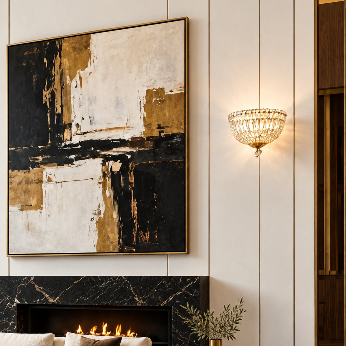 Petit Crystal Deluxe 3-light wall sconce in gold displayed in a gallery-style luxury living room