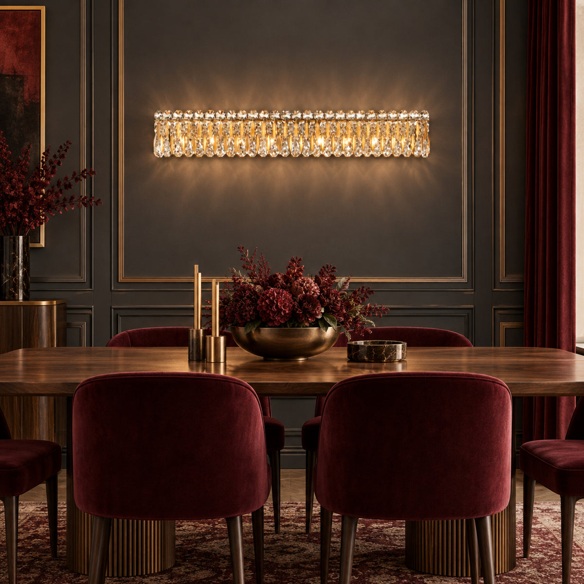 Sarella 8-light wall sconce in heirloom gold with heritage crystal displayed in an oxblood modern Art Deco dining room