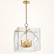 Travis 8-light foyer lantern in aged brass on a warm ivory background