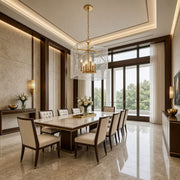 Travis 8-light foyer lantern in aged brass displayed in a refined neutral luxury dining room